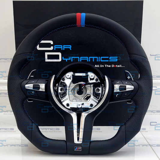 Black steering wheel with Car Dynamics branding on a white background