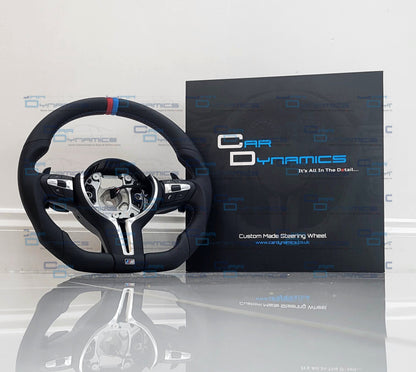 BMW Steering wheel and packaging on a white surface