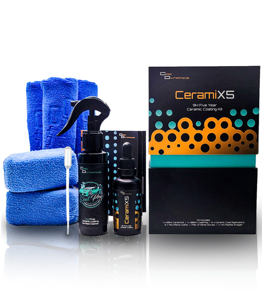 Ceramic coating kit with microfibre towels, spray bottles, and packaging on a white background