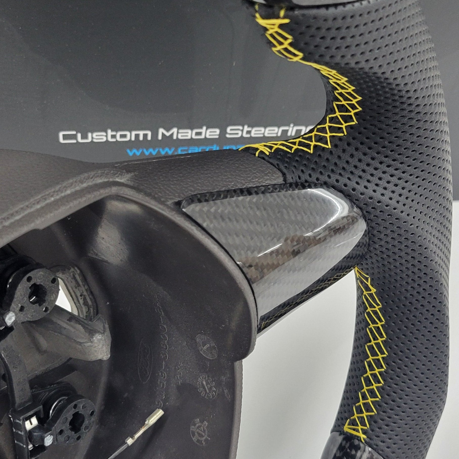 Yellow steering wheel stitching